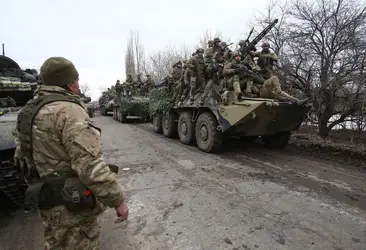 Soldats ukrainiens partant au combat, 2022 - crédits : Anatolii Stepanov/ AFP